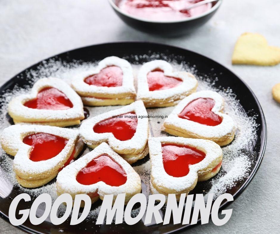 Hearts with red cookie in the plate white text good morning image