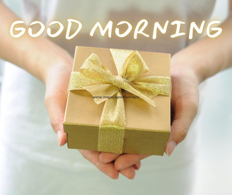 lady hold the yellow colour gift with yellow ribbon box good morning images box