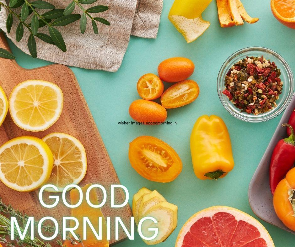 light Green background with orange, yellow capsicum many fruit good morning image text colour yellow with white border