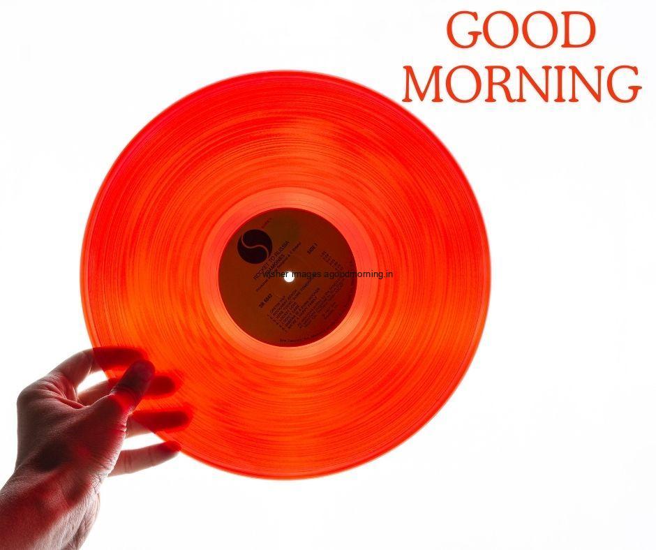 orange colour circle with holded by hand red colour good morning images