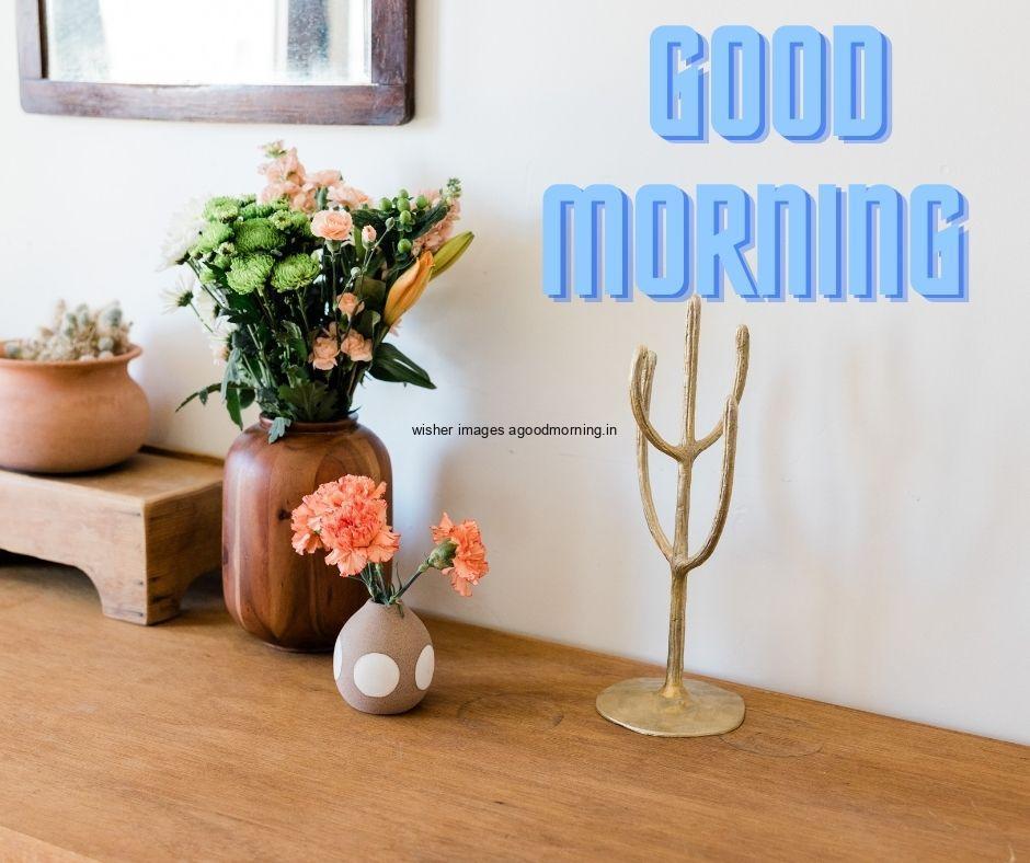 Orange with yellow flowers with brown floor and white wall good morning flower images