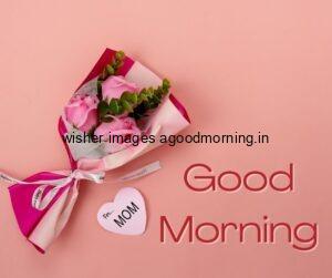 Pink background with red text good morning image with pink rose with leaf