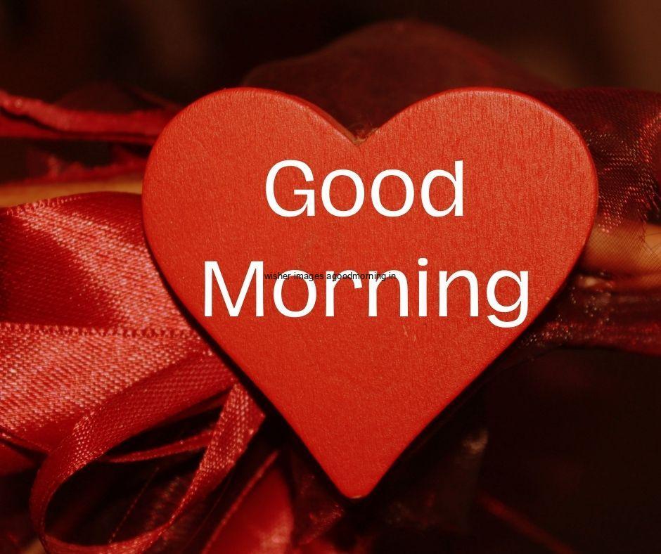 red heart in the middle good morning love image with white text