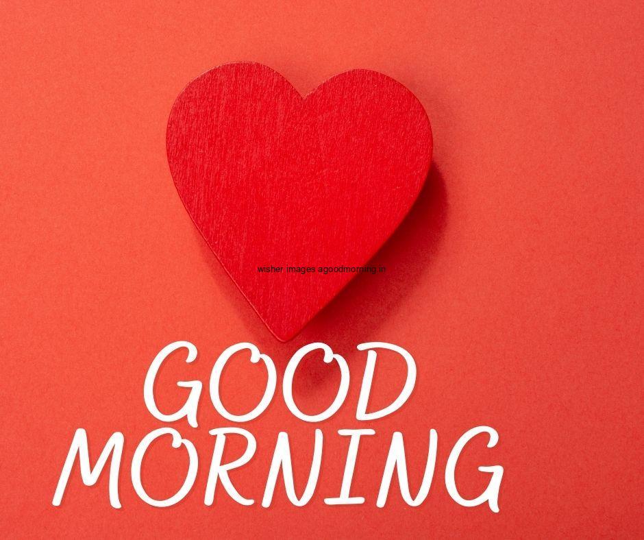 Red hearts with red colour background white and red colour good morning quote is placed