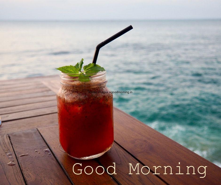 red-jucie-on-the-deck-with-sea-good-morning-image-good-morning-text-white HD Good Morning Food Images Free download