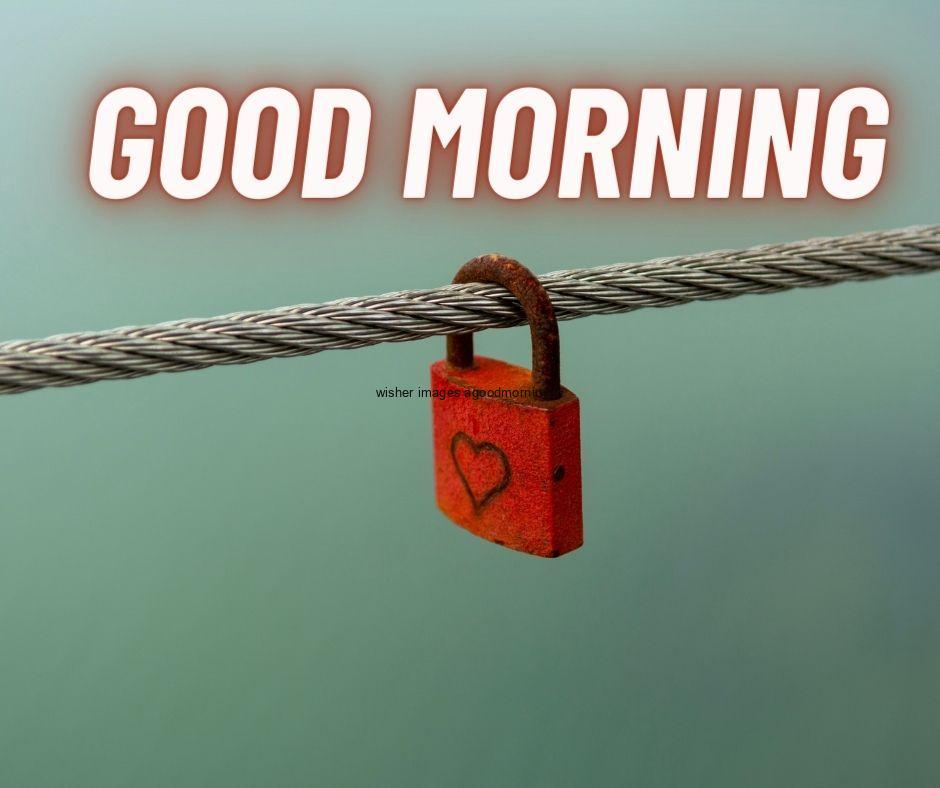 Red lock is hanging on the rope good morning quote is placed and background setup with sky