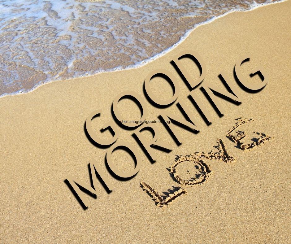 Sand create the love and good morning quote is placed on the sand with sea water