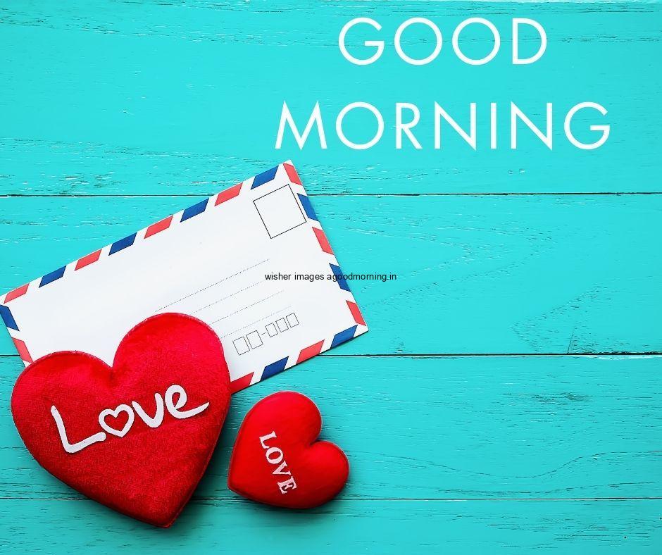 Sky blue with white text good morning quote is placed with red hearts and white letters