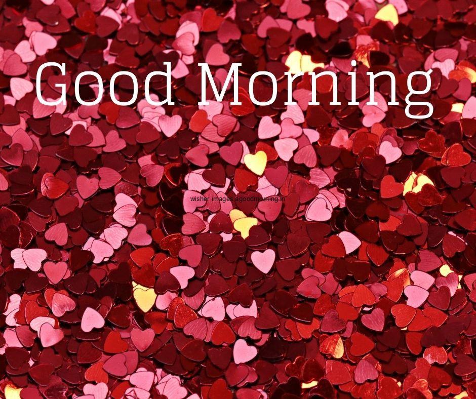 Small pink or red heart is placed behind the background good morning quote is placed