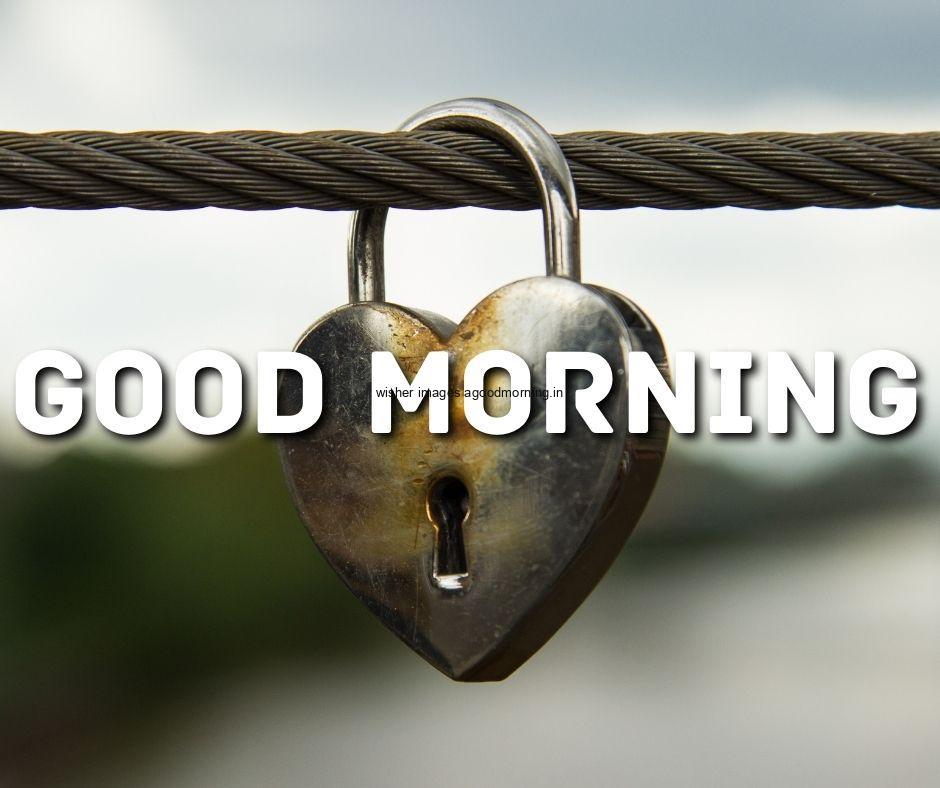 Steel lock is hanging on the rope good morning quote is placed and background setup with sky