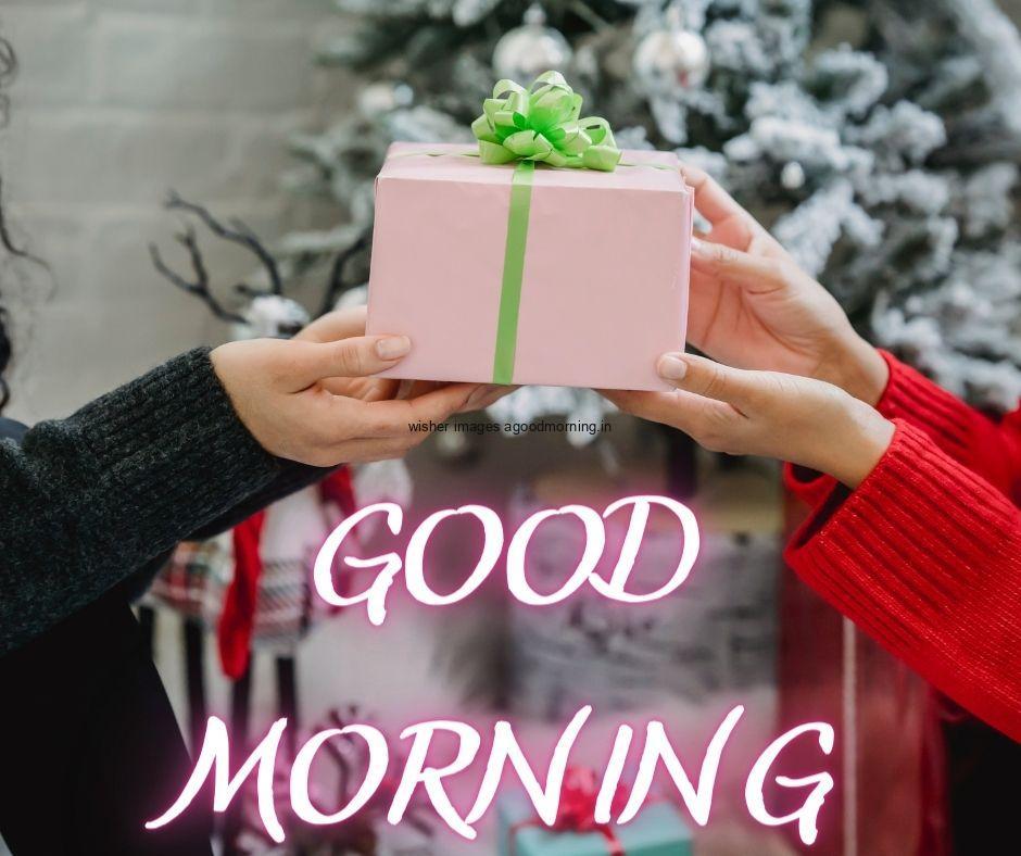 69+ Good Morning Images With Gift Boxes 32 two hand holding the gift box with green ribbon good morning image