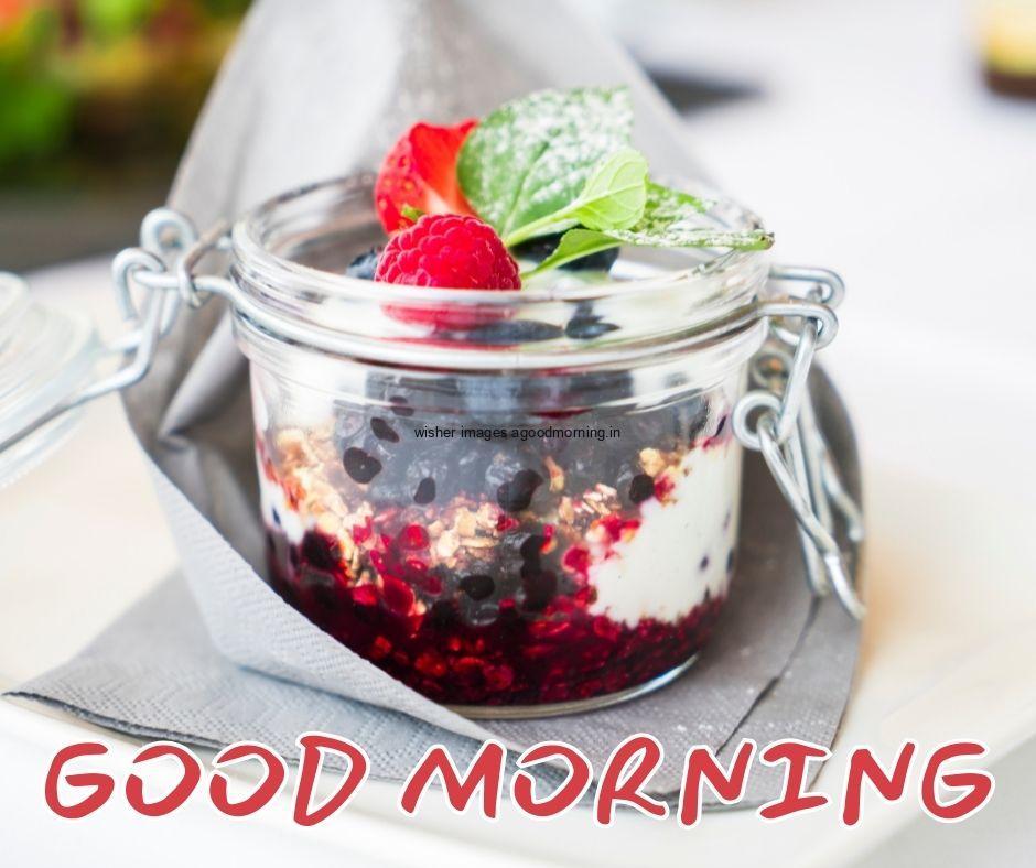 white background with strawberryice-cream in glass bowl circles good morning image text colour red with white border