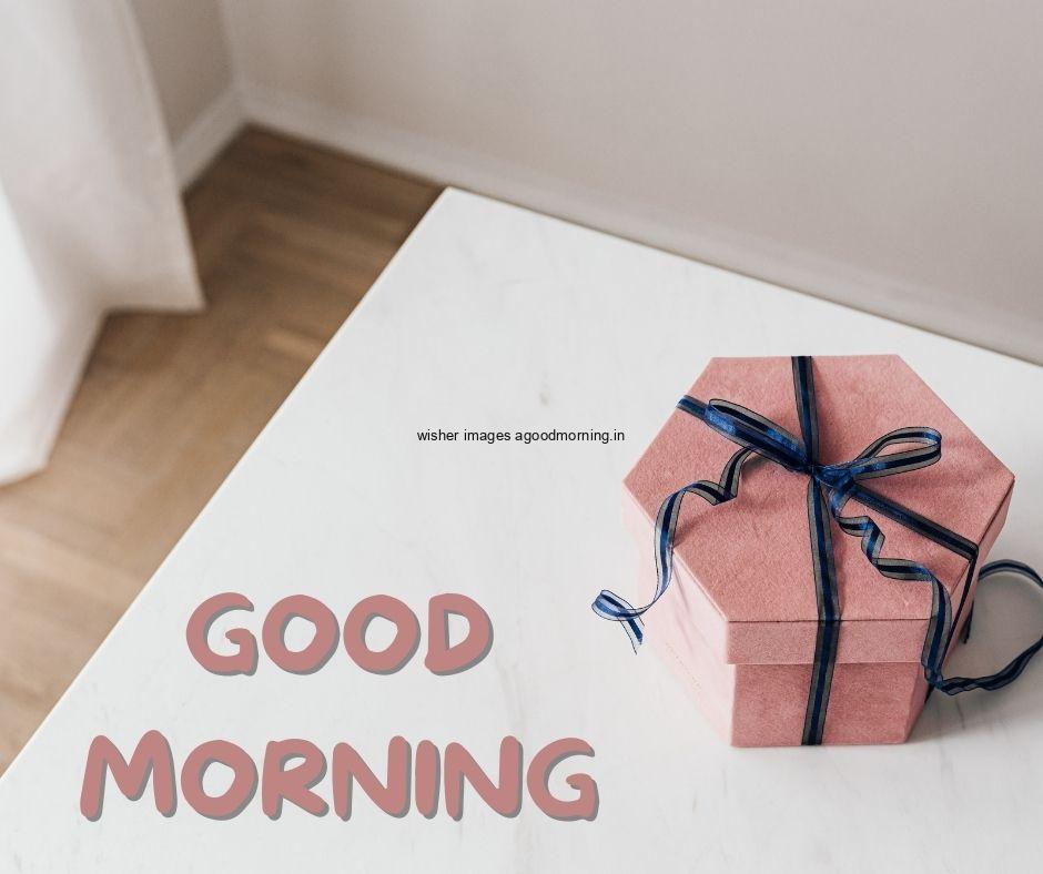 White colour background with breautiful pink,white colour gift boxes, purple ribbon good morning images box