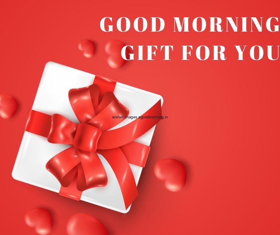 White gift box with ribbons with red background good morning quote is placed