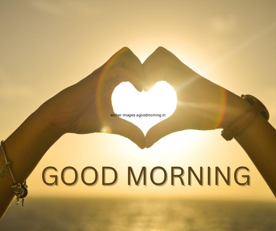 yellow with sun light background with hand create heart shape good morning image