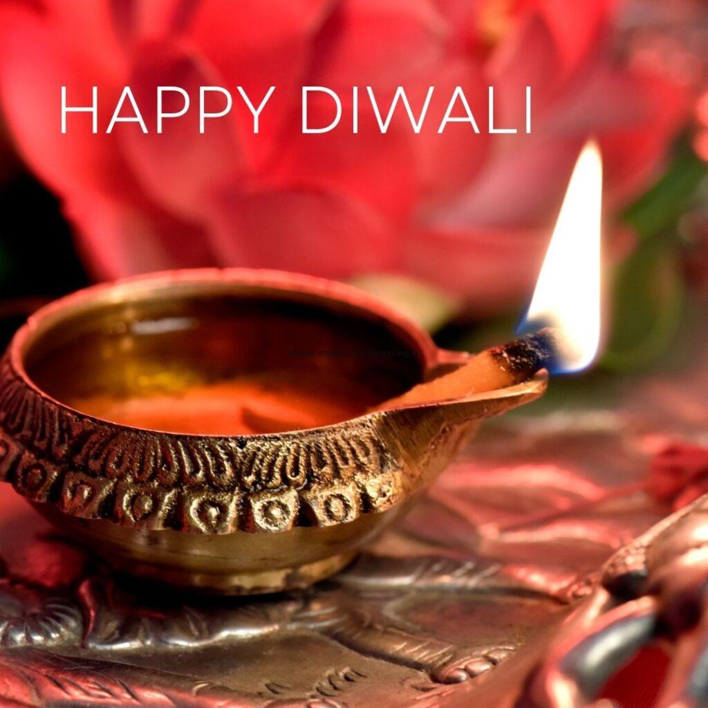 Beautiful golden diya with red background happy diwali image