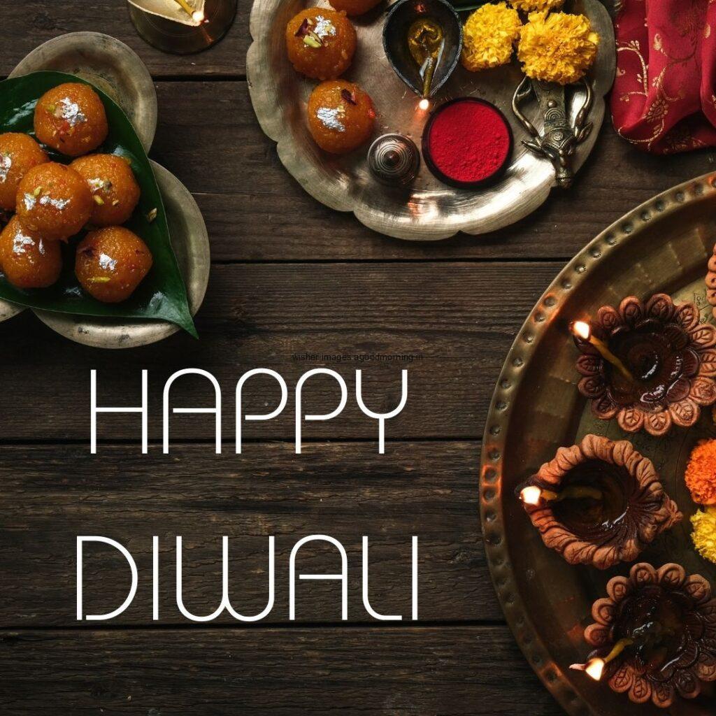 dark background with sweets on the plate beautiful flowers placed on plate happy diwali image