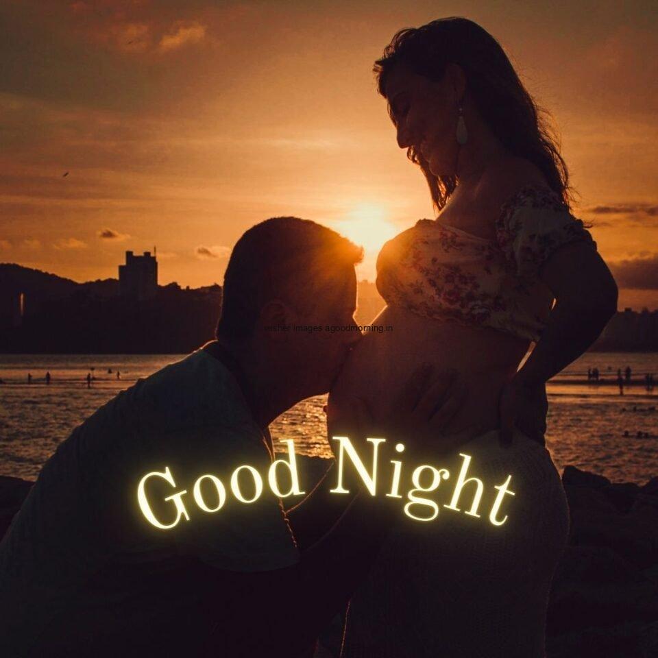 men kiss on the women in the night beautifull background with good night placed on the top good night image