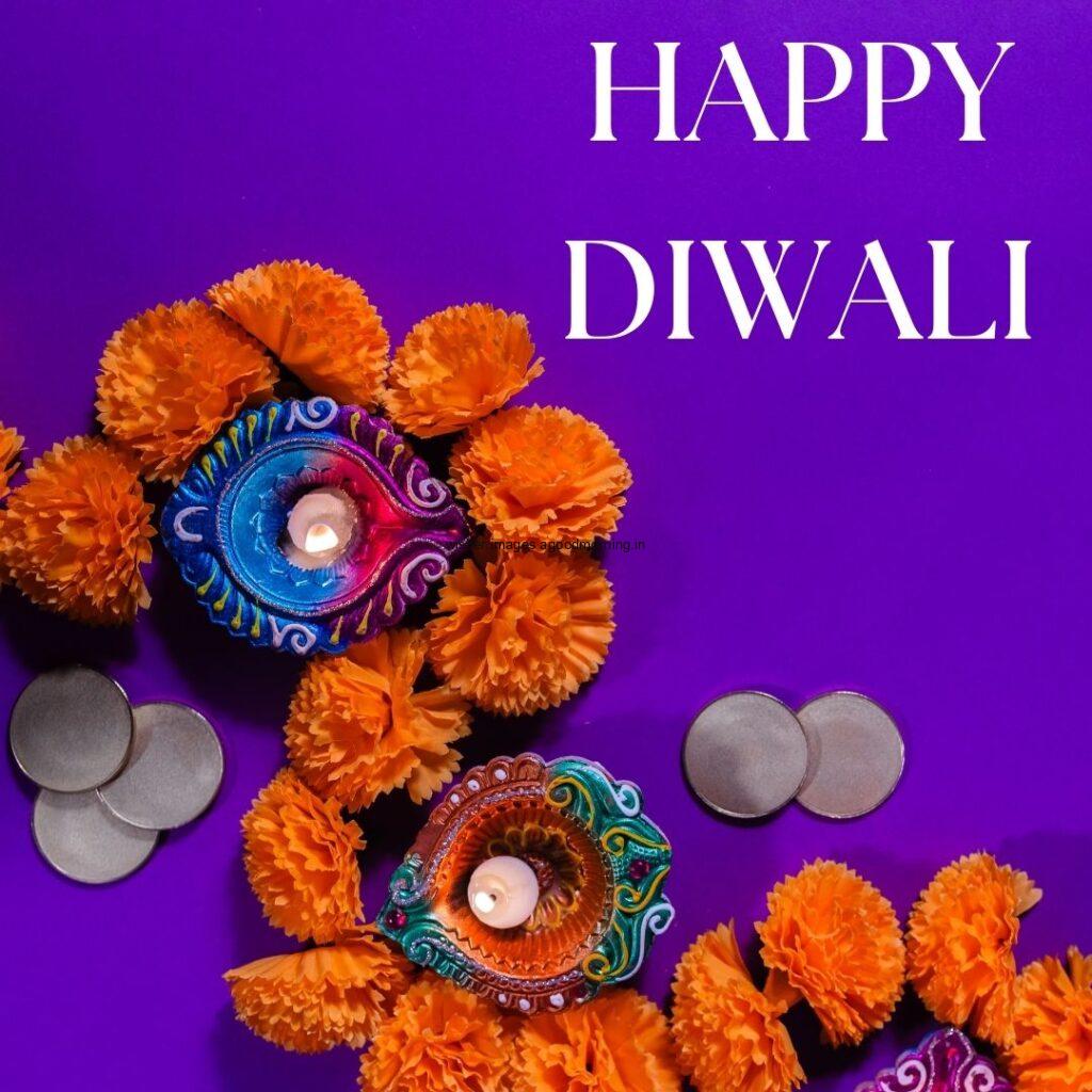 purple background with colourful diya with flowers happy diwali image