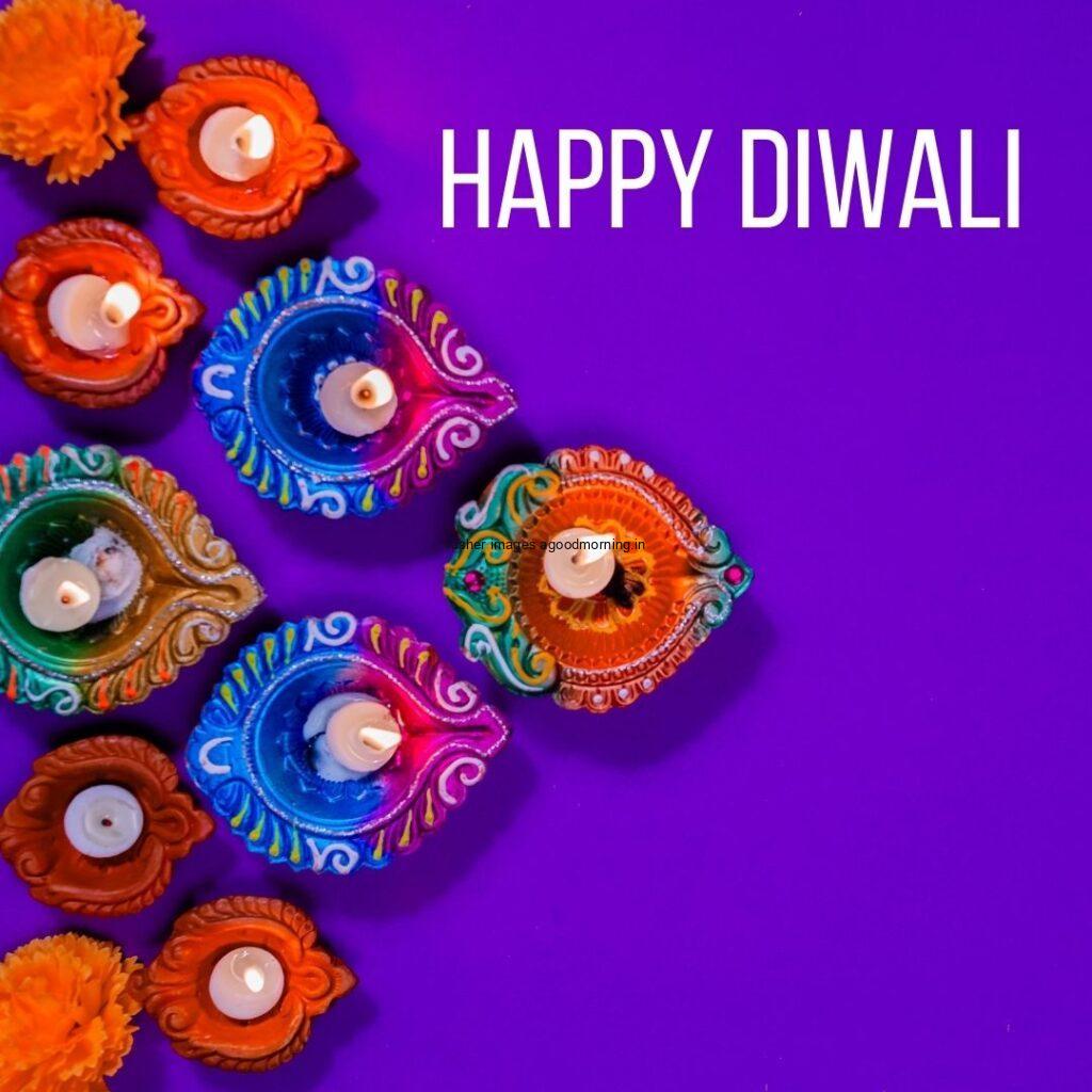 purple background with many colourful diya happy diwali images