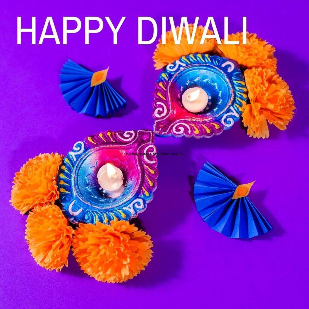 purple background with purple with blue diya happy diwali