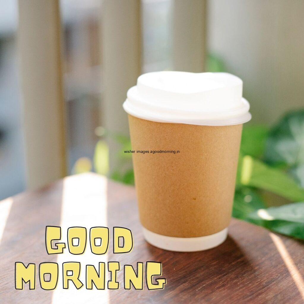 the coffee cup on the table with Beautiful background good morning image