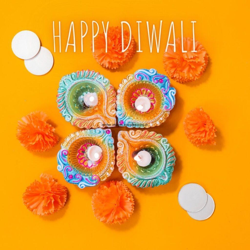 yellow background with colourful diya with flowers happy diwali image